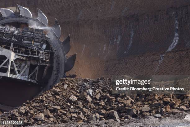 a bucket wheel excavates soil and rocks - 褐炭 ストックフォトと画像