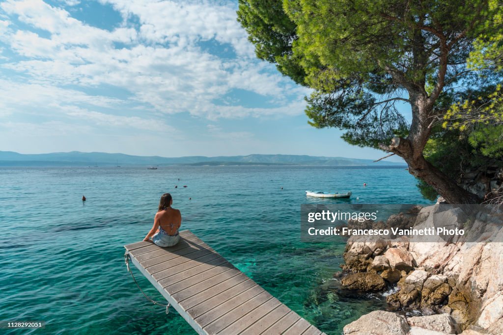 Woman by the sea, Brac Island, Croatia.