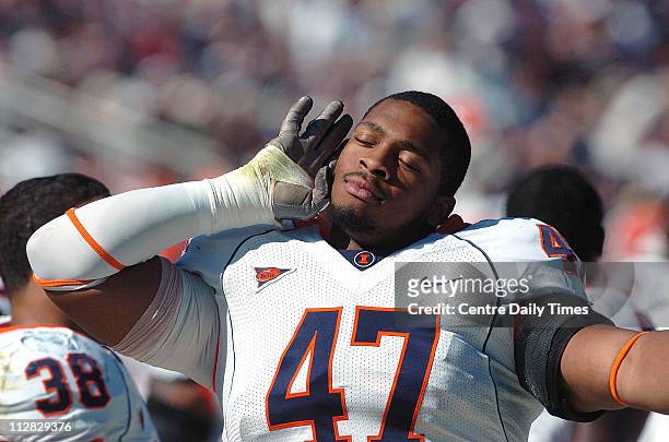 Illinois reserve defensive tackle Glenn Foster listens to the silenced Beaver Stadium crowd after the Illini scored a touchdown in the third quarter...