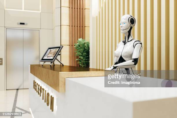 smart robot assistant on reception - robot stock pictures, royalty-free photos & images