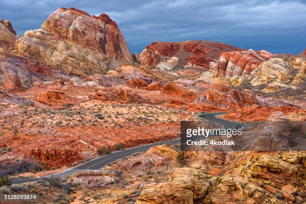 desert road on red rock canyon - valley of fire state park stock pictures, royalty-free photos & images