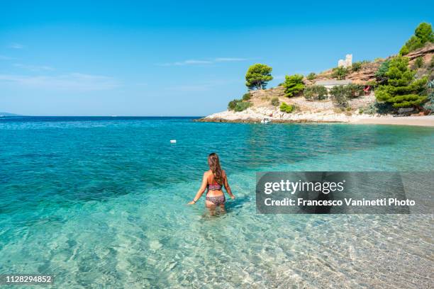 woman at the seaside, brac island, croatia. - brac island stock pictures, royalty-free photos & images