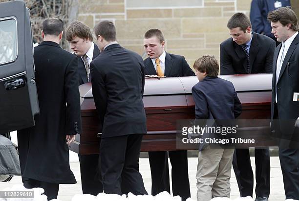 The casket is carried out of St. Rita of Cascia Shrine Chapel in Chicago, Illinois, Monday, March 1, 2010 after the funeral of SeaWorld's Dawn...