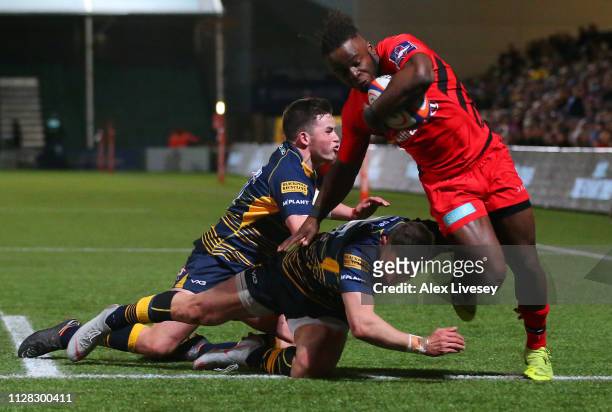Rotimi Segun of Saracens beats the tackle as he crosses the line to score their second try during the Premiership Rugby Cup semi-final match between...