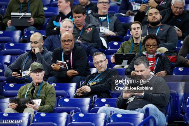 Group of coaches and scouts from various NFL teams observe the action during day two of the NFL Combine at Lucas Oil Stadium on March 1, 2019 in...