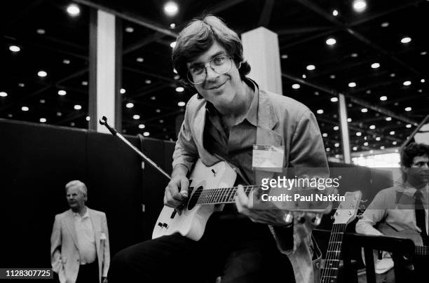 American Rock and Pop musician John Sebastian (plays guitar as he performs during the NAMM Convention at McCormick Place, Chicago, Illinois, June 20,...