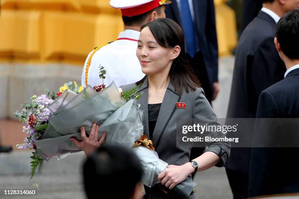 Kim Yo Jong, sister of North Korean leader Kim Jong Un, holds a flower bouquet during a welcoming ceremony at the Presidential Palace in Hanoi,...