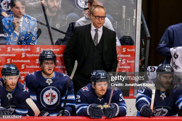 Head Coach Paul Maurice of the Winnipeg Jets looks on from the bench during second period action against the Nashville Predators at the Bell MTS...