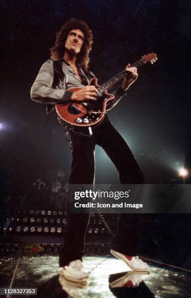 English singer, songwriter and lead guitarist for the rock band Queen, Brian May, onstage at Cobo Arena, on November 18 in Detroit, Michigan.