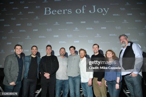 Aaron Goldfard, Jonathan Hack, David Swift, Scott Owen, Mike Cooley, Ryan Daley, Joe Vogelbacher, Tonya Cornett and Sean Z. Paxton pose as...