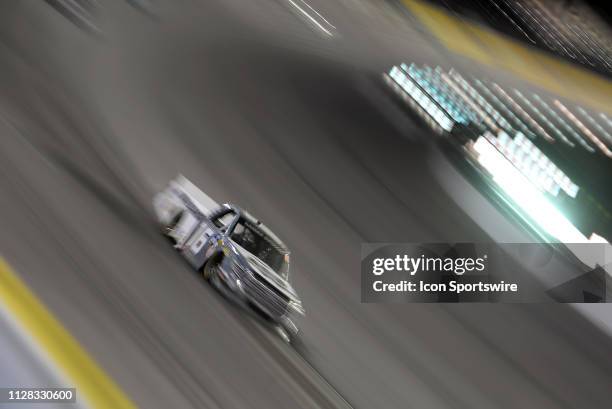 Austin Hill Hattori Racing Enterprises Toyota Tundra is a blur of speed as he works his way into turn four during the NASCAR Gander Outdoors Truck...