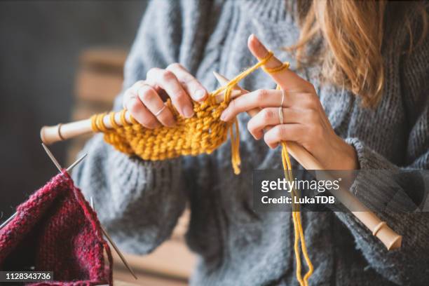 close up on woman's hands knitting - wool stock pictures, royalty-free photos & images