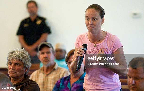 Kindra Arneson, the wife of a Gulf Coast fisherman, nearly cries as she grills government officials about the use of dispersants over an oil spill...