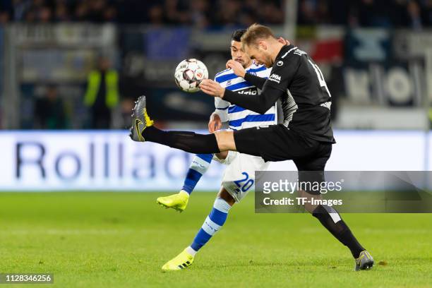 Cauly Oliveira Souza of Duisburg and Jan Kirchhoff of Magedburg battle for the ball during the Second Bundesliga match between MSV Duisburg and 1. FC...