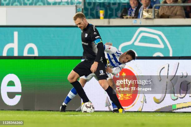 Jan Kirchhoff and Fabian Schnellhardt of Duisburg battle for the ball during the Second Bundesliga match between MSV Duisburg and 1. FC Magdeburg at...