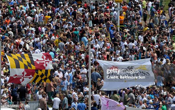 The infield crowd revels prior to the 135th running of the Preakness Stakes at Pimlico Race Course in Baltimore, Maryland, on Saturday, May 15, 2010.