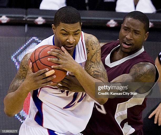 Kansas forward Marcus Morris ripped the ball away from Texas A&M guard Donald Sloan , after Sloan got caught in a trap in the first half of a...