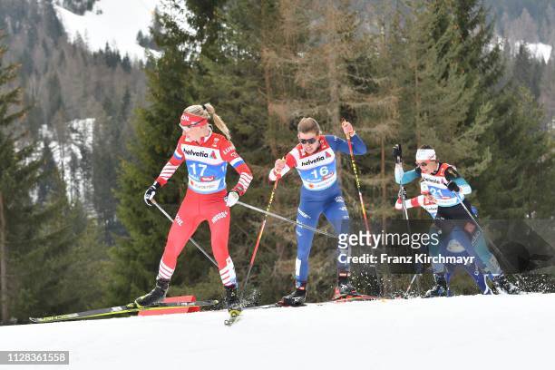 Anna Nechaevskaya of Russia, Rosie Brennan of the United States and Anouk Faivre Picon of France during the Women's Cross Country 30km at the FIS...