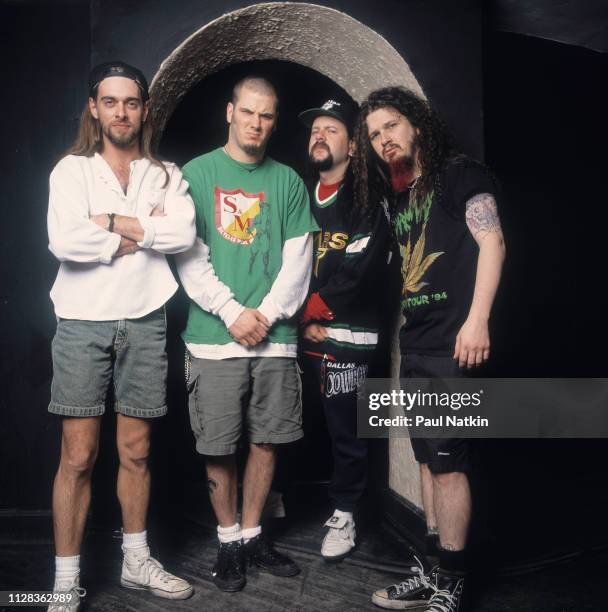 Portrait of American Rock group Pantera backstage at the Aragon Ballroom, Chicago, Illinois, March 4, 1993. Pictured are, from left, Rex Brown, Phil...