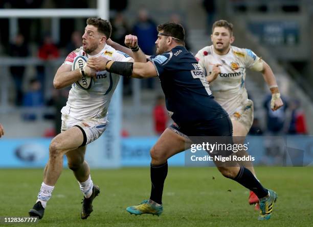 Rob Webber of Sale Sharks tackles Alex Cuthbert of Exeter Chiefs during the Gallagher Premiership Rugby match between Sale Sharks and Exeter Chiefs...