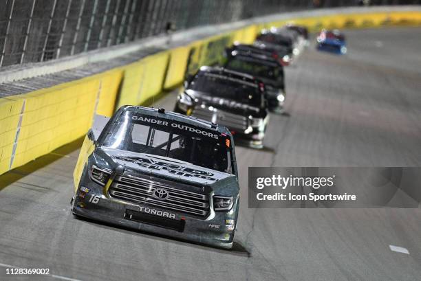 Austin Hill Hattori Racing Enterprises Toyota Tundra leads a pack of trucks down the backstretch during the NASCAR Gander Outdoors Truck Series The...