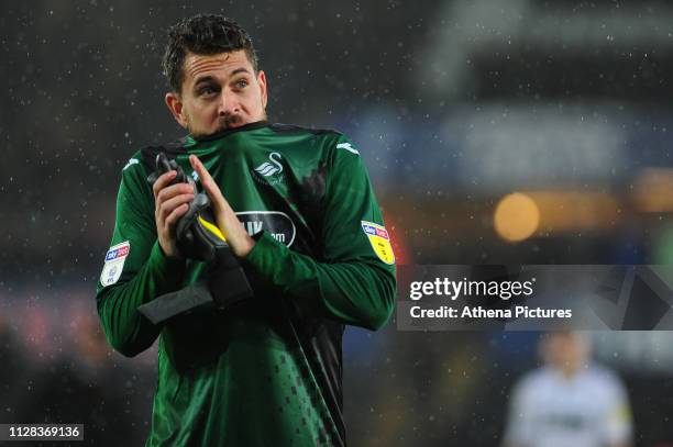 Kristoffer Nordfeldt of Swansea City applauds the fans at the final whistle during the Sky Bet Championship match between Swansea City and Bolton...
