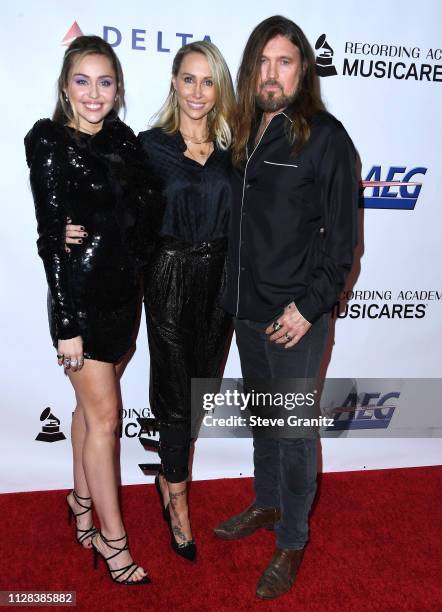 Tish Cyrus, Billy Ray Cyrus, Miley Cyrus arrives at the 2019 MusiCares Person Of The Year Honoring Dolly Parton at Los Angeles Convention Center on...
