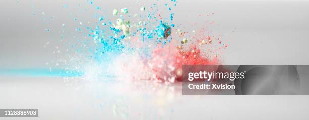 jumping color flour flying in the sky captured with high speed - colorful powder explosion stockfoto's en -beelden