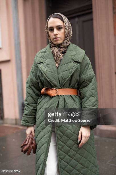 Mademoiselle Meme is seen on the street during New York Fashion Week AW19 wearing leopard print hijab, army green quilted down coat, brown leather...