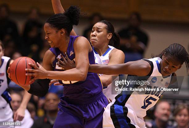 Duke's Bridgette Mitchell and Joy Cheek pressure LSU's Courtney Jones during first-half action in the second round of the 2010 NCAA Women's...