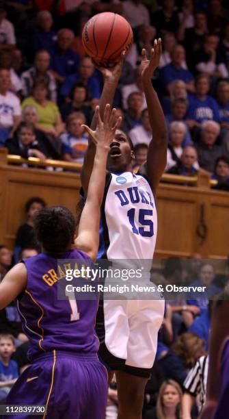 Duke's Bridgette Mitchell shoots over the defense of LSU's Katherine Graham during first-half action. Duke defeated LSU, 60-52, in the second round...