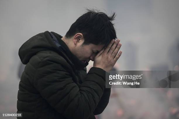 Man worships the God of Fortune at the Guiyuan Temple on February 09, 2019 in Wuhan, Hubei province, China. The fifth day in the lunar new year is...