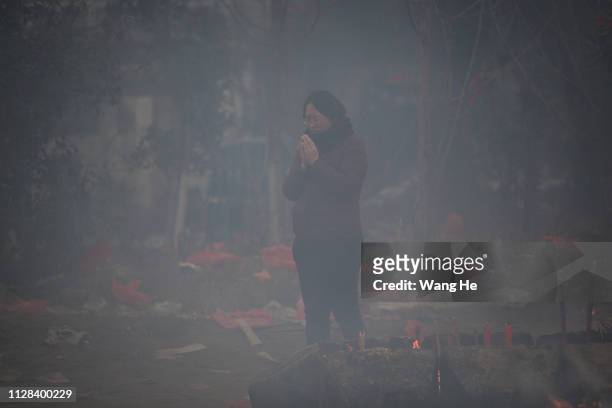 Women worships the God of Fortune at the Guiyuan Temple on February 09, 2019 in Wuhan, Hubei province, China. The fifth day in the lunar new year is...