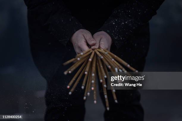 Man worships the God of Fortune at the Guiyuan Temple on February 09, 2019 in Wuhan, Hubei province, China. The fifth day in the lunar new year is...