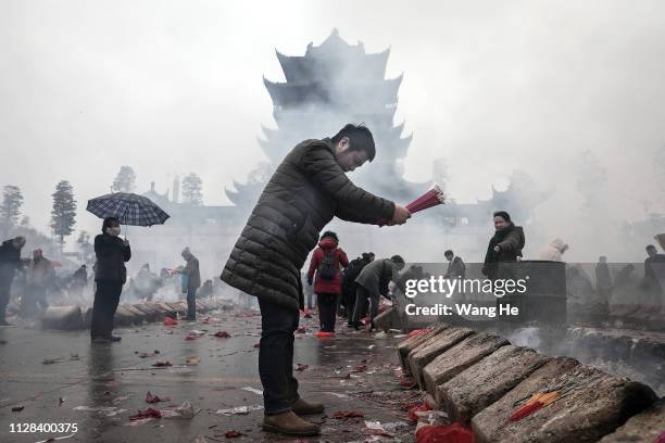 Man worships the God of Fortune at the Guiyuan Temple on February 09, 2019 in Wuhan, Hubei province, China. The fifth day in the lunar new year is...