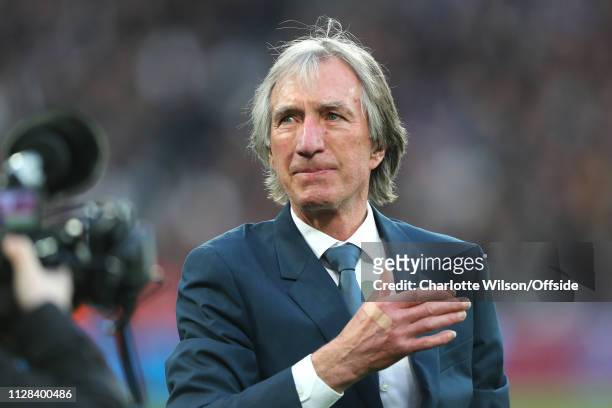 Teary eyed Billy Bonds claps a hand over his chest as he walks onto the pitch to open a stand named after him ahead of the Premier League match...