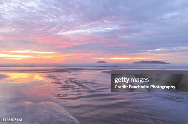 sunset colours at tanjung aru beach - beauty in nature beach fantasy stock pictures, royalty-free photos & images