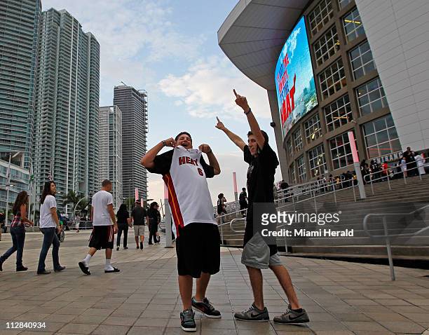 Sam Jacobs, left, and Adam Feldman, right, arrive for the Miami Heat home opener against the Orlando Magic at the AmericanAirlines Arena in Miami,...