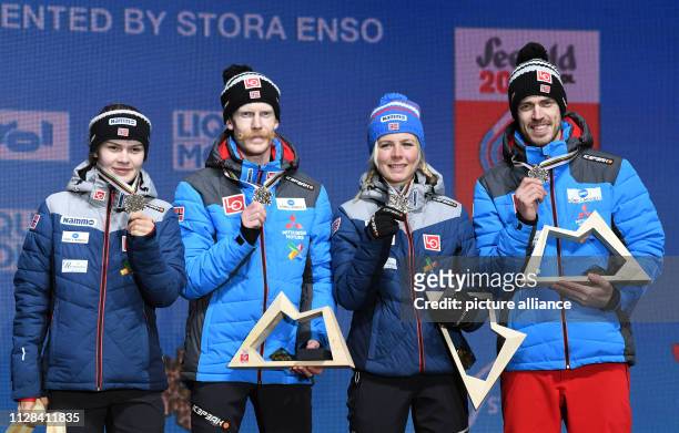 March 2019, Austria, Seefeld: Ski jumping, world championship, team jumping, mixed, medal ceremony. Anna Odine Ström , Robert Johansson, Maren Lundby...
