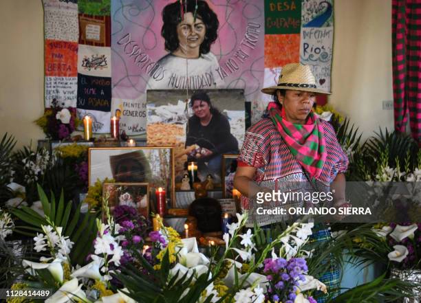 An indigenous woman visits an altar in homage to Honduran late environmentalist Berta Caceres, on the eve of the third anniversary of her murder in...
