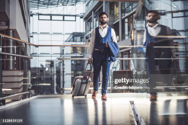 businessman traveling. - carry on bag stock pictures, royalty-free photos & images