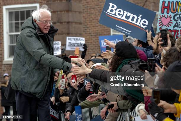 Senator Bernie Sanders, an Independent from Vermont and 2020 presidential candidate, left, greets attendees while arriving to a campaign rally in the...