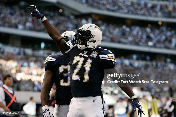 San Diego Chargers running back LaDainian Tomlinson celebrates his first-quarter touchdown against the Dallas Cowboys in the first quarter. The...