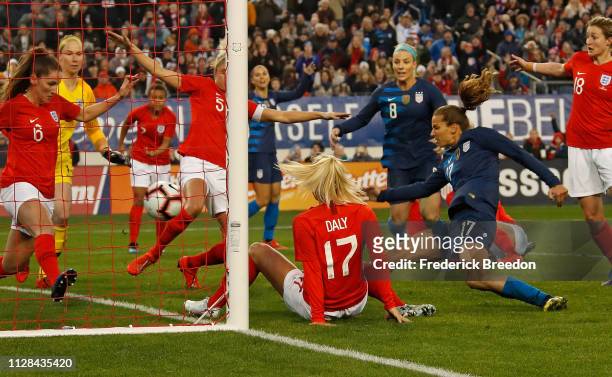 Tobin Heath scores a goal against England during the second half of the 2019 SheBelieves Cup match between the United States and England at Nissan...