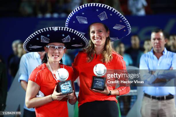 Saisai Zheng of China and Victoria Azarenka of Belarus celebrate with the trophy of Women's Doubles final as part of the day 6 of the Telcel Mexican...