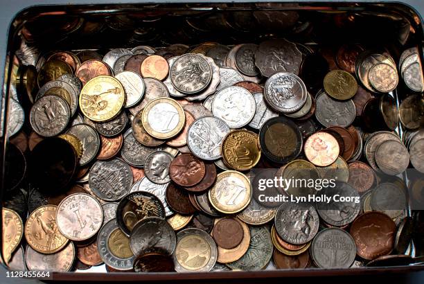 tin of coins of various currencies - hong kong currency bildbanksfoton och bilder