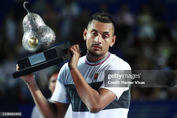 Nick Kyrgios of Australia celebrates with the champion trophy during the final match between Nick Kyrgios of Australia and Alexander Zverev of...