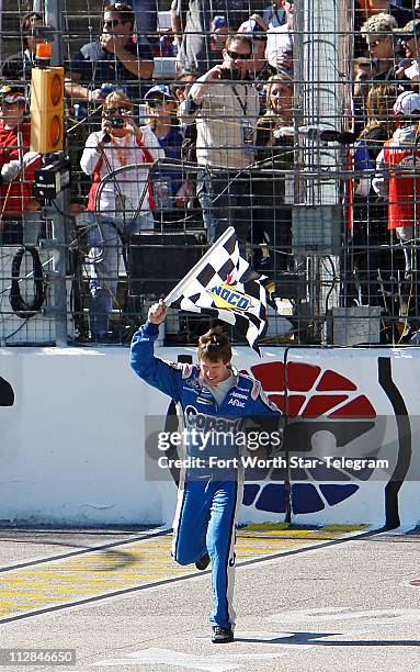 Carl Edwards celebrates his win in the NASCAR Nationwide Series O'Reilly Auto Parts Challenge at Texas Motor Speedway in Fort Worth, Texas, Saturday,...