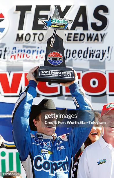 Carl Edwards celebrates his win in the NASCAR Nationwide Series O'Reilly Auto Parts Challenge at Texas Motor Speedway in Fort Worth, Texas, Saturday,...