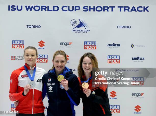 Natalia Maliszewska of Poland celebrates winning the second place, Martina Valcepina of Italy celebrates winning the first place and Kim Boutin of...